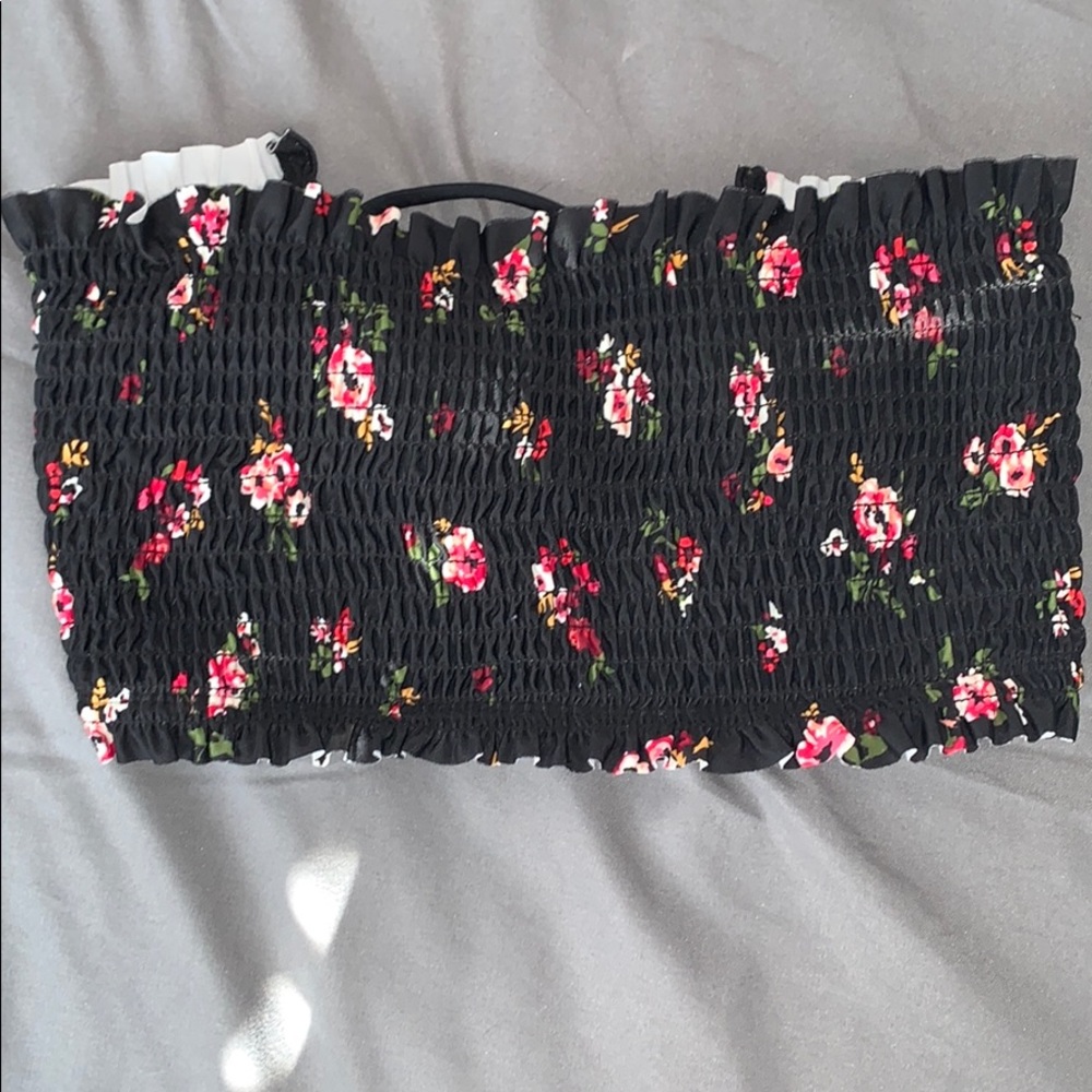 a black strapless bathing suit top w/ pink flowers